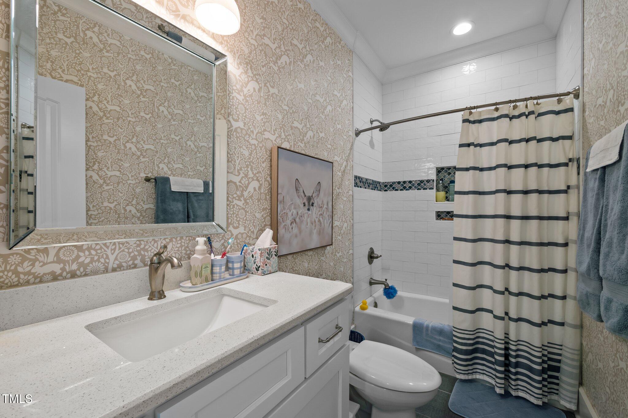 976 Estate Road Semora, NC 27343 - Photo 43 of 69 a bathroom with a sink toilet vanity and shower