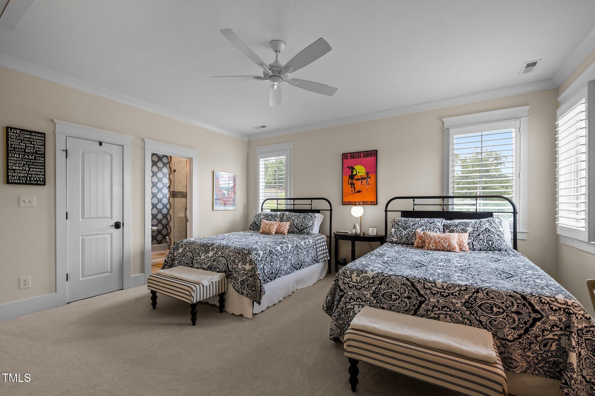 976 Estate Road Semora, NC 27343 - Photo 45 of 69 a bedroom with two beds and a chandelier