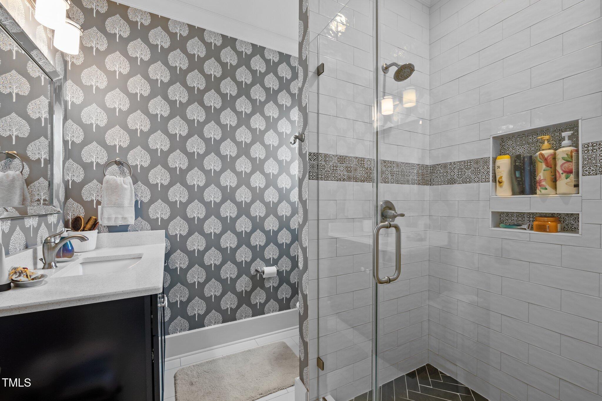 976 Estate Road Semora, NC 27343 - Photo 46 of 69 a bathroom with a sink and shower