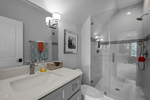 a aerial view of a house with swimming pool and green space