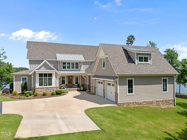 a front view of a house with a yard table and chairs