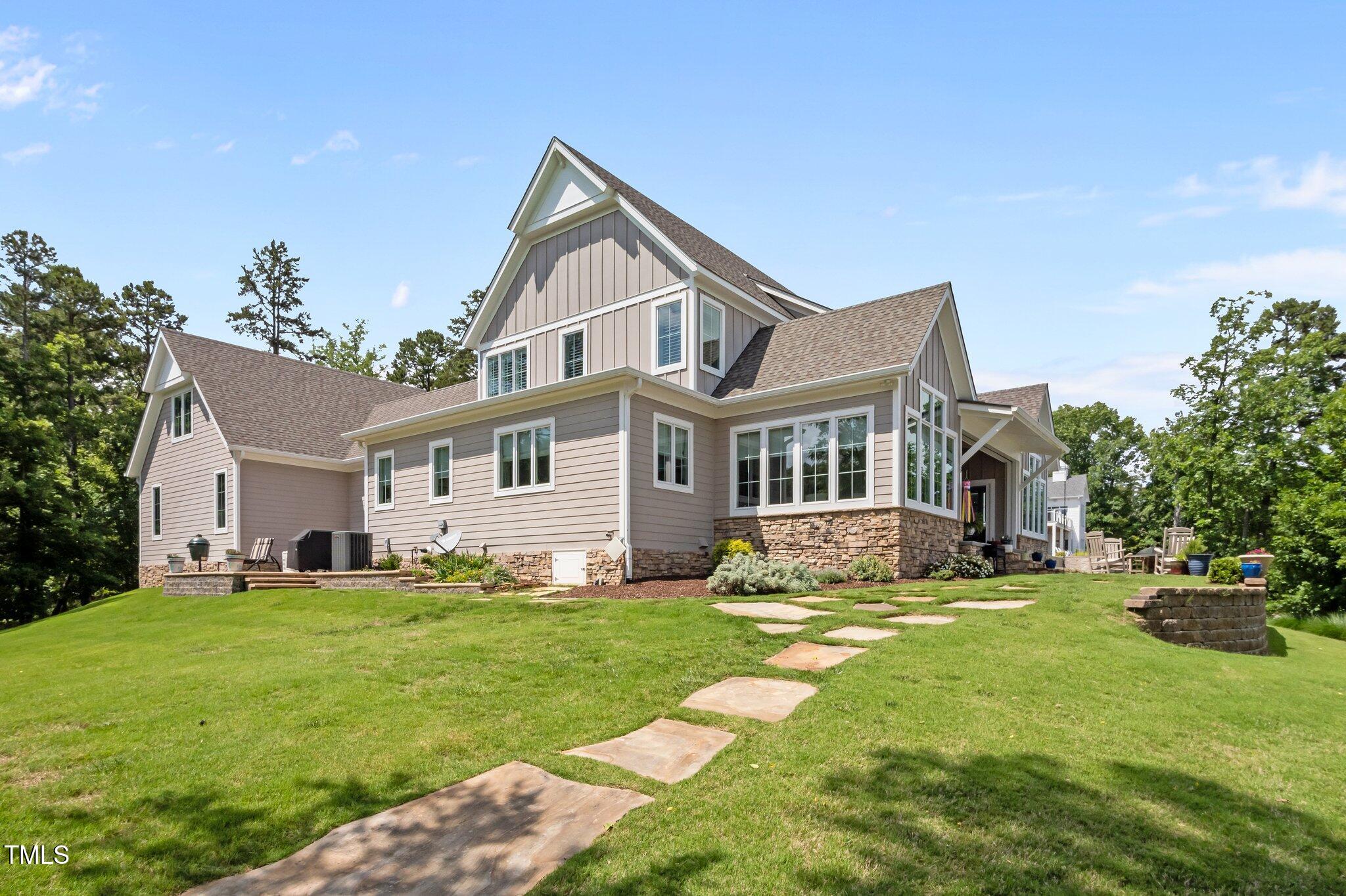976 Estate Road Semora, NC 27343 - Photo 53 of 69 a front view of a house with a yard and garage