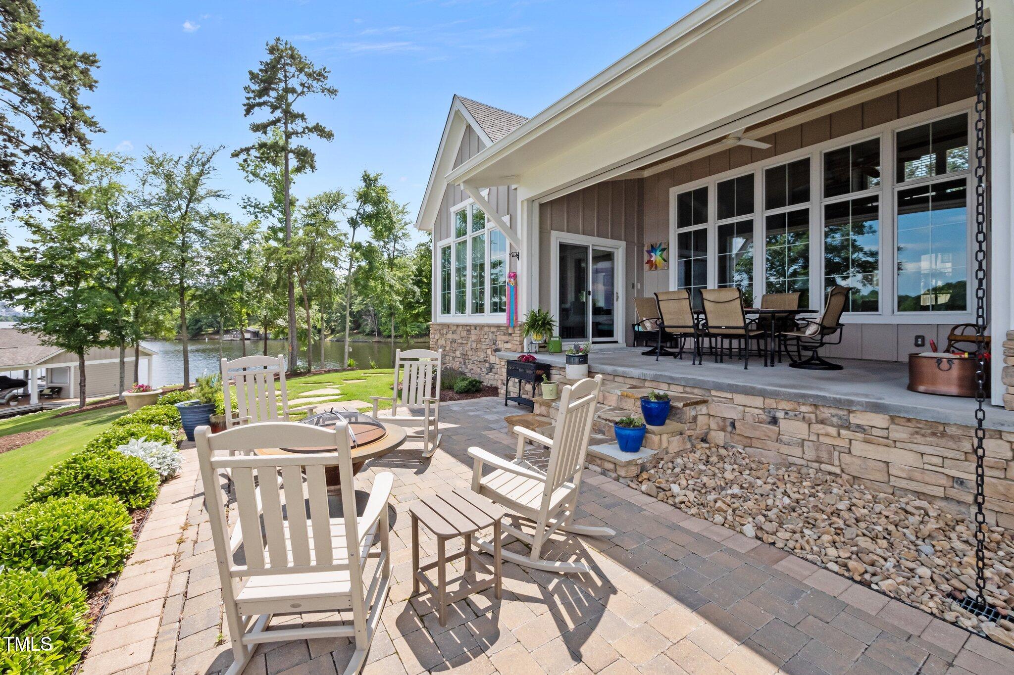 976 Estate Road Semora, NC 27343 - Photo 9 of 69 a view of an house with backyard porch and patio