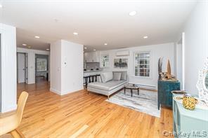 70 New Paltz Road, Unit 1B Highland, NY 12528 - Photo 3 of 7 a living room with furniture and a table