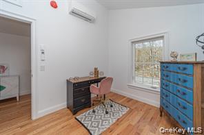 70 New Paltz Road, Unit 1B Highland, NY 12528 - Photo 5 of 7 a room with furniture and wooden floor