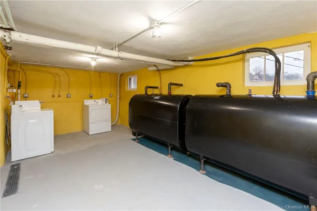 a blue chair sitting in a room next to a window