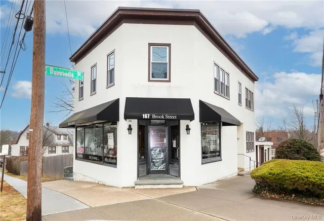 a front view of a house with a garage