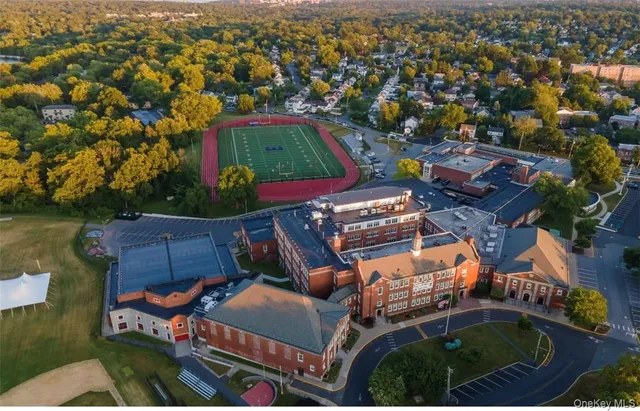 an aerial view of a house with a lake view