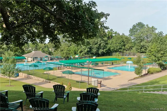 a view of a swimming pool with a lounge chairs