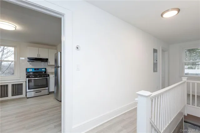 a kitchen with a refrigerator and a stove