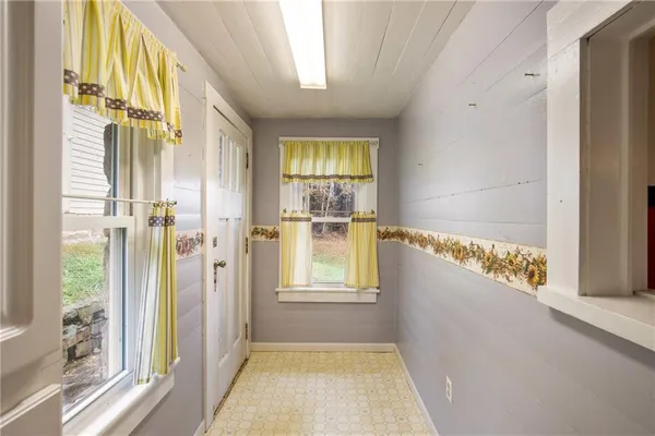 a view of a bathroom with a tub and shower
