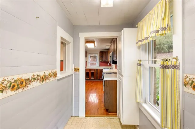 a view of a bathroom with tub and door