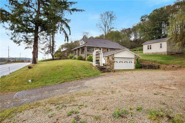an aerial view of a houses with outdoor space
