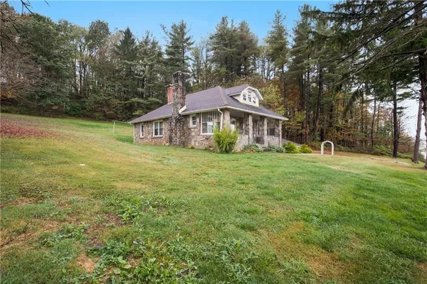 a house with trees in the background
