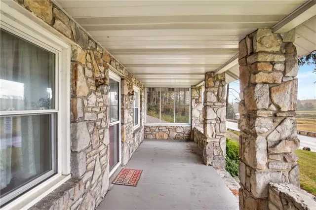 a view of a porch with a furniture