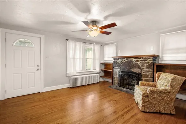a living room with furniture and a fireplace