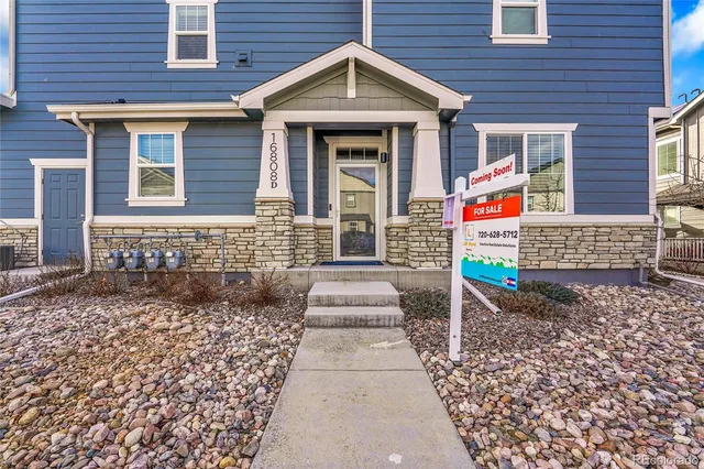a front view of a house with garage