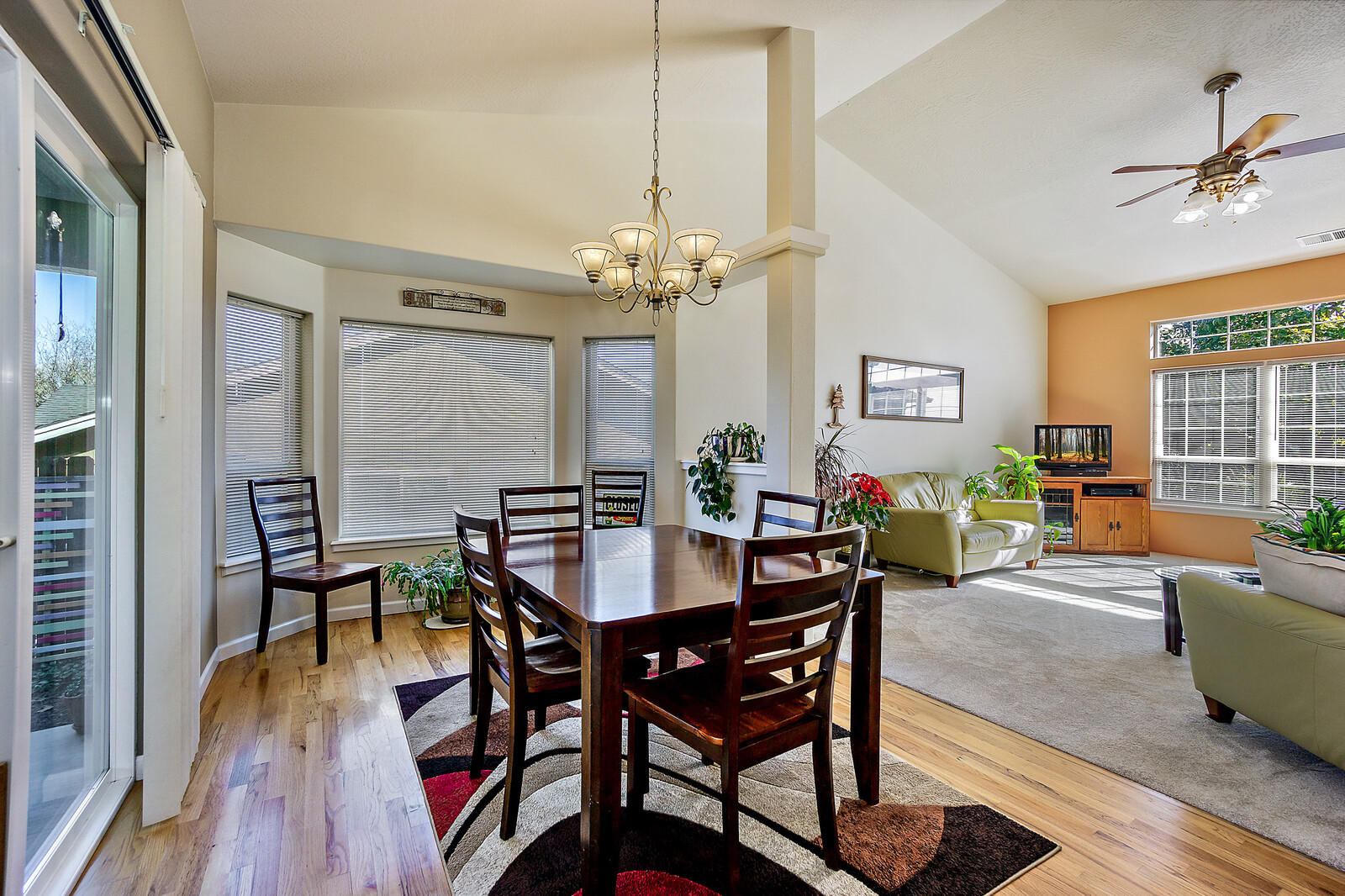 890 Ridgeview Drive Eagle Point, OR 97524 - Photo 10 of 35 a view of a dining room with furniture window and wooden floor