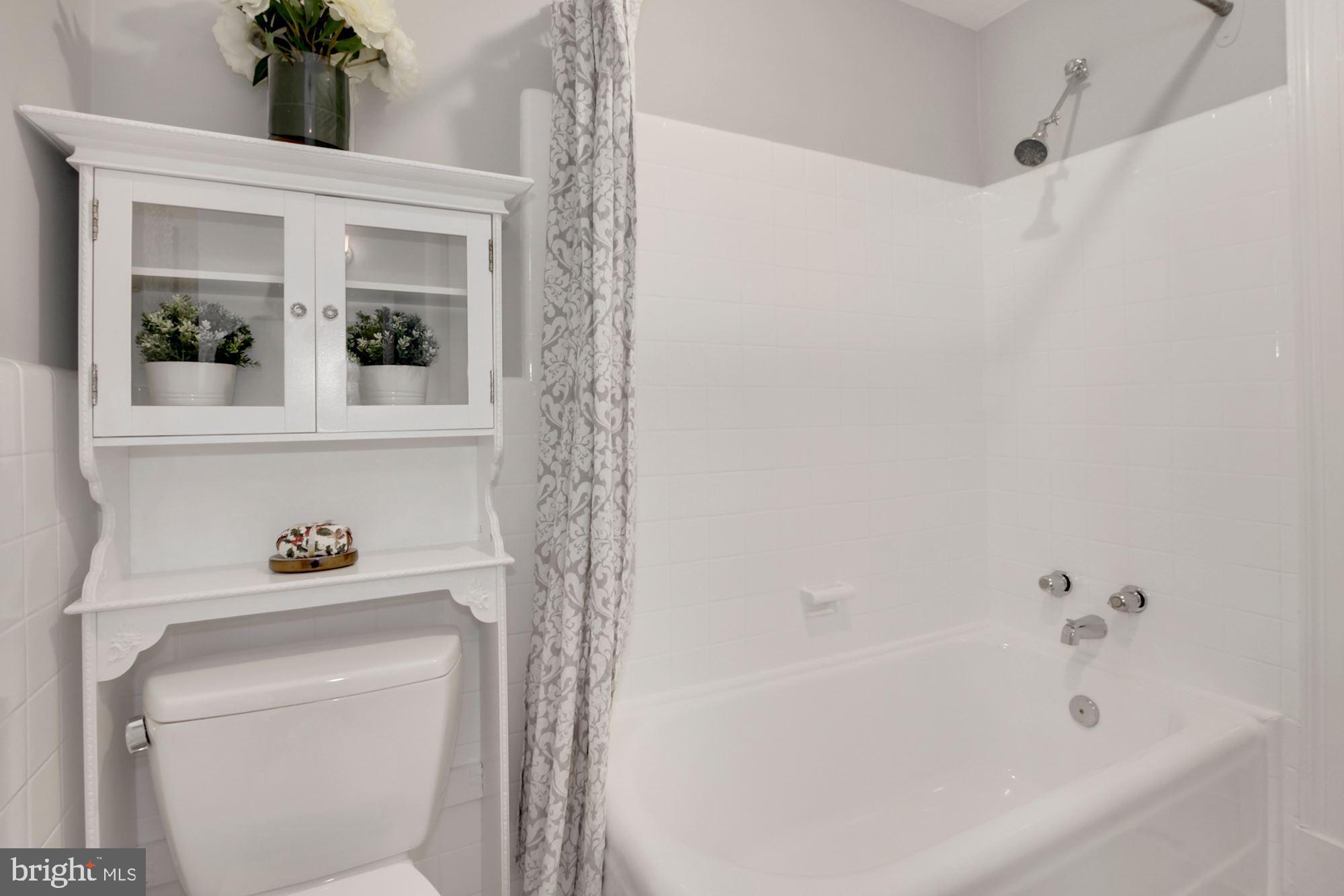 801 Violet Place Silver Spring, MD 20910 - Photo 24 of 35 Full bath -bright white tile