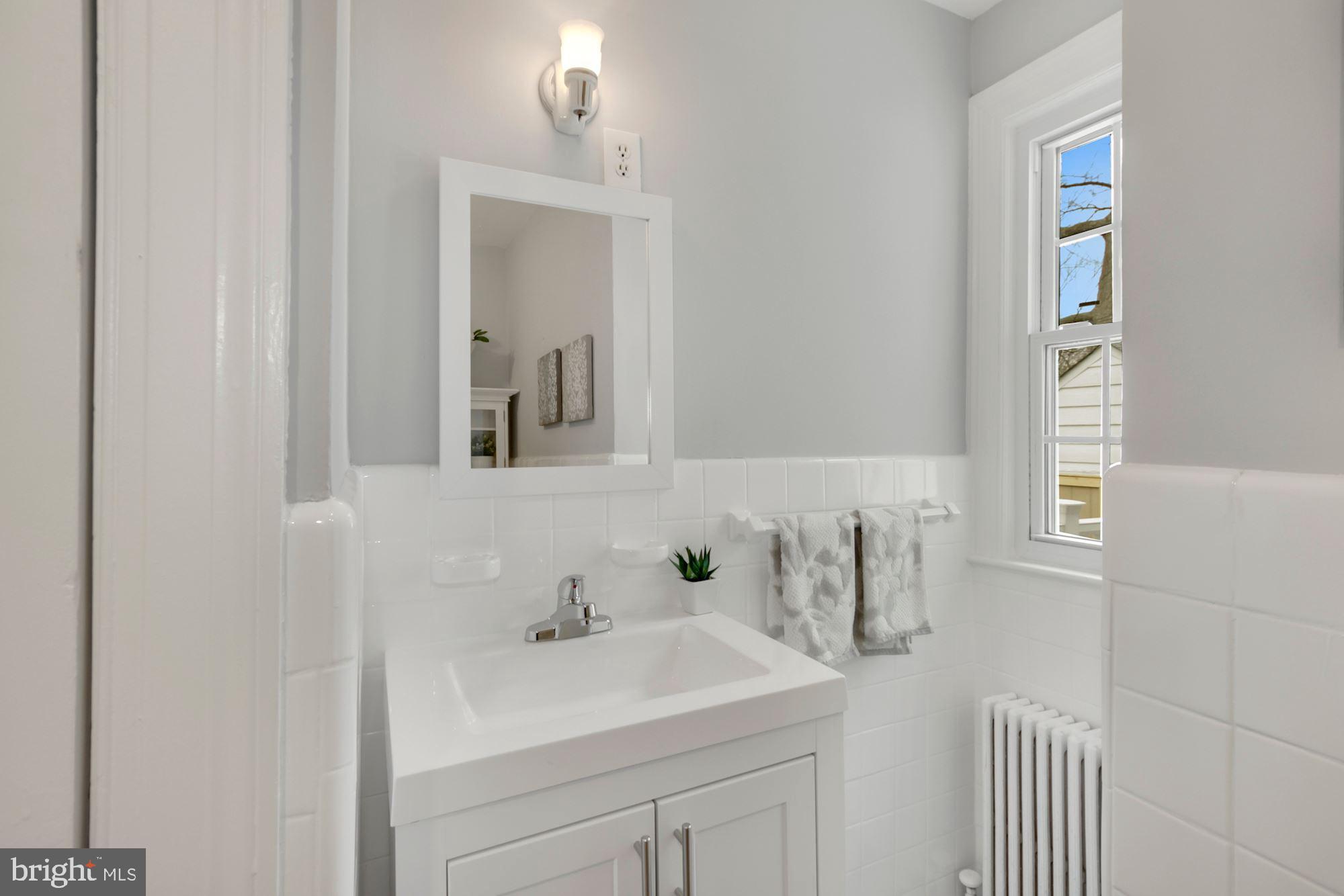 801 Violet Place Silver Spring, MD 20910 - Photo 25 of 35 New sink vanity, vintage sconce
