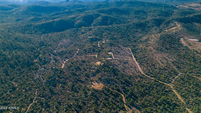 a view of a road with snow on side of the road