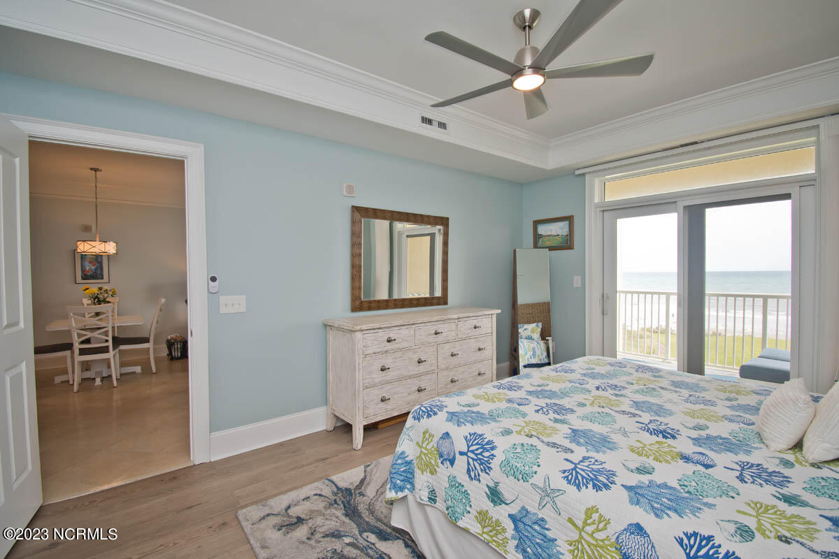 1435 Salter Path Road, Unit I 2 Indian Beach, NC 28512 - Photo 10 of 54 Access the oceanfront balcony from the primary suite. New lvp flooring in 2021.