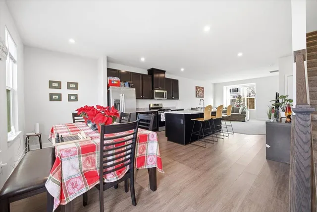 a kitchen view with microwave a stove and cabinets
