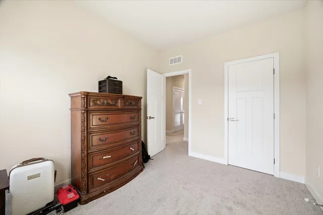 a room with a dresser and a couch