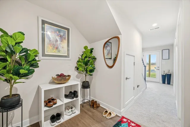 a view of room with furniture and potted plant