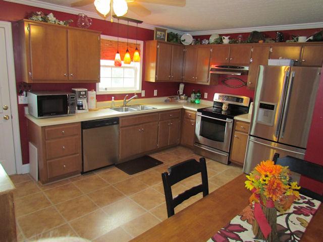 471 Old Hunters Point Pike North Lebanon, TN 37087 - Photo 9 of 16 Kitchen includes vinyl flooring, a ceiling fan, stainless dishwasher and a stainless smooth top self cleaning oven.