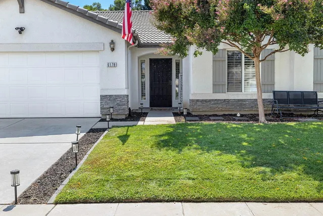 a view of a backyard with a small pool