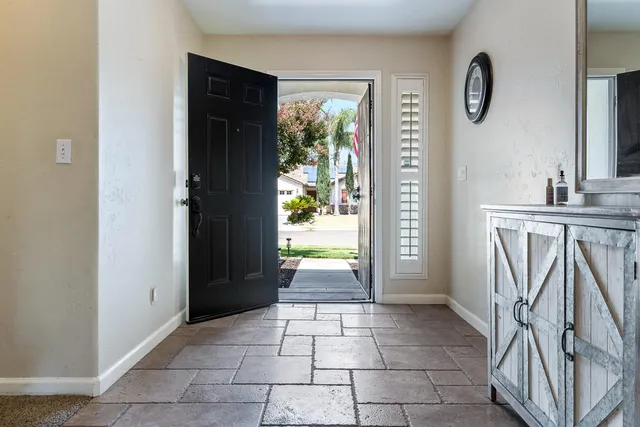 a view of a bathroom with tub and door