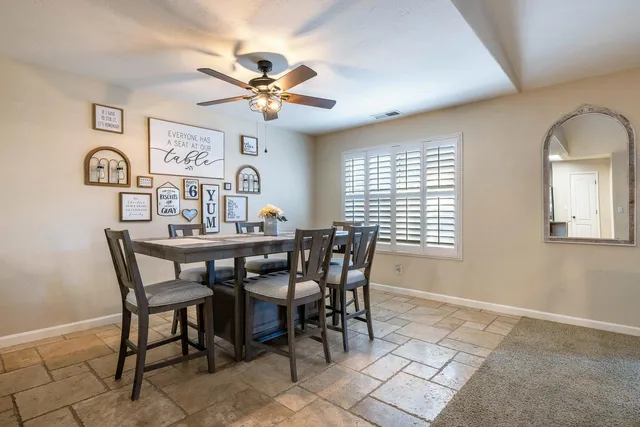 a view of a dining room with furniture