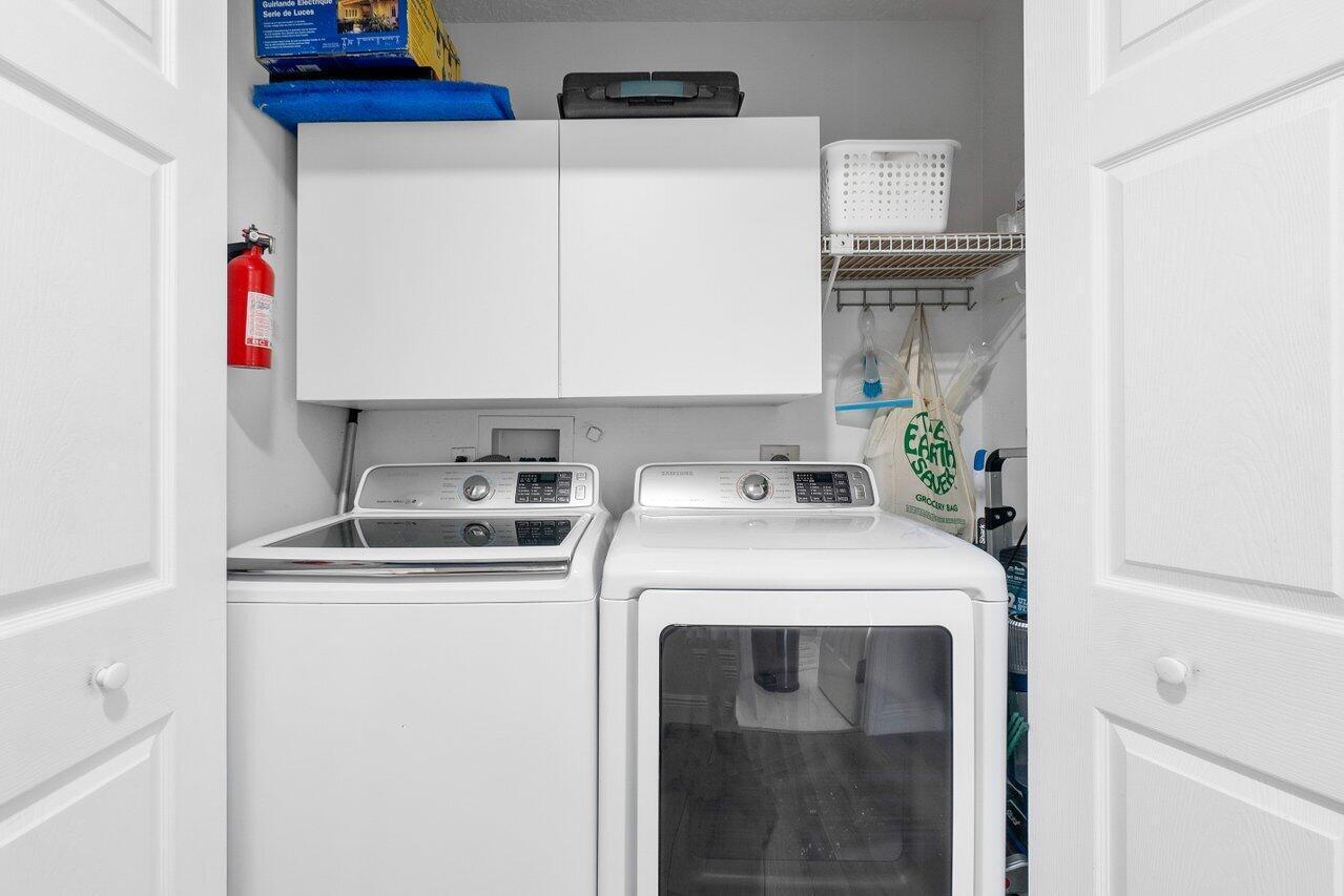 6085 Robinson Street Jupiter, FL 33458 - Photo 22 of 32 a utility room with dryer and washer