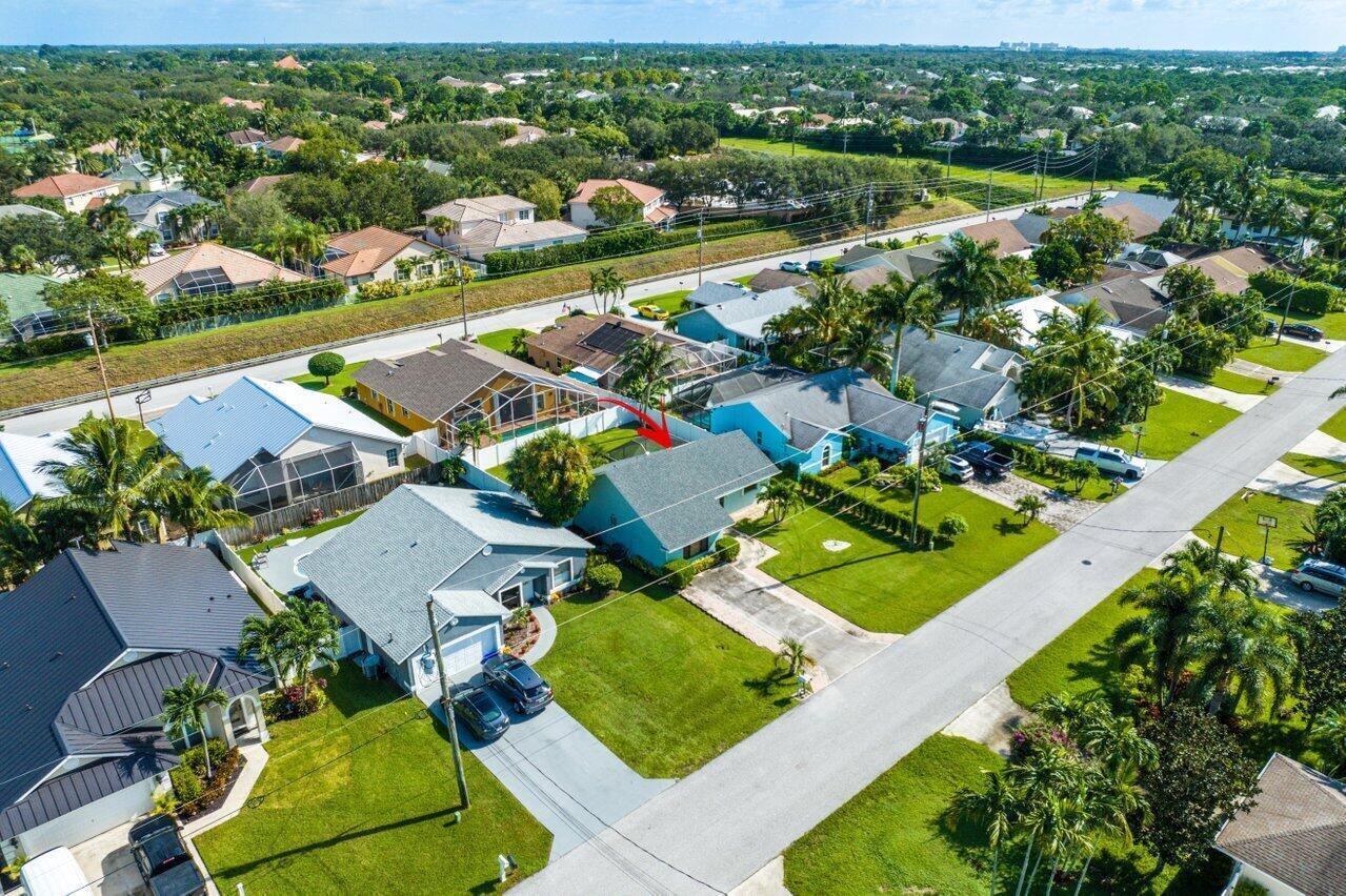 6085 Robinson Street Jupiter, FL 33458 - Photo 28 of 32 an aerial view of residential houses with outdoor space and river view