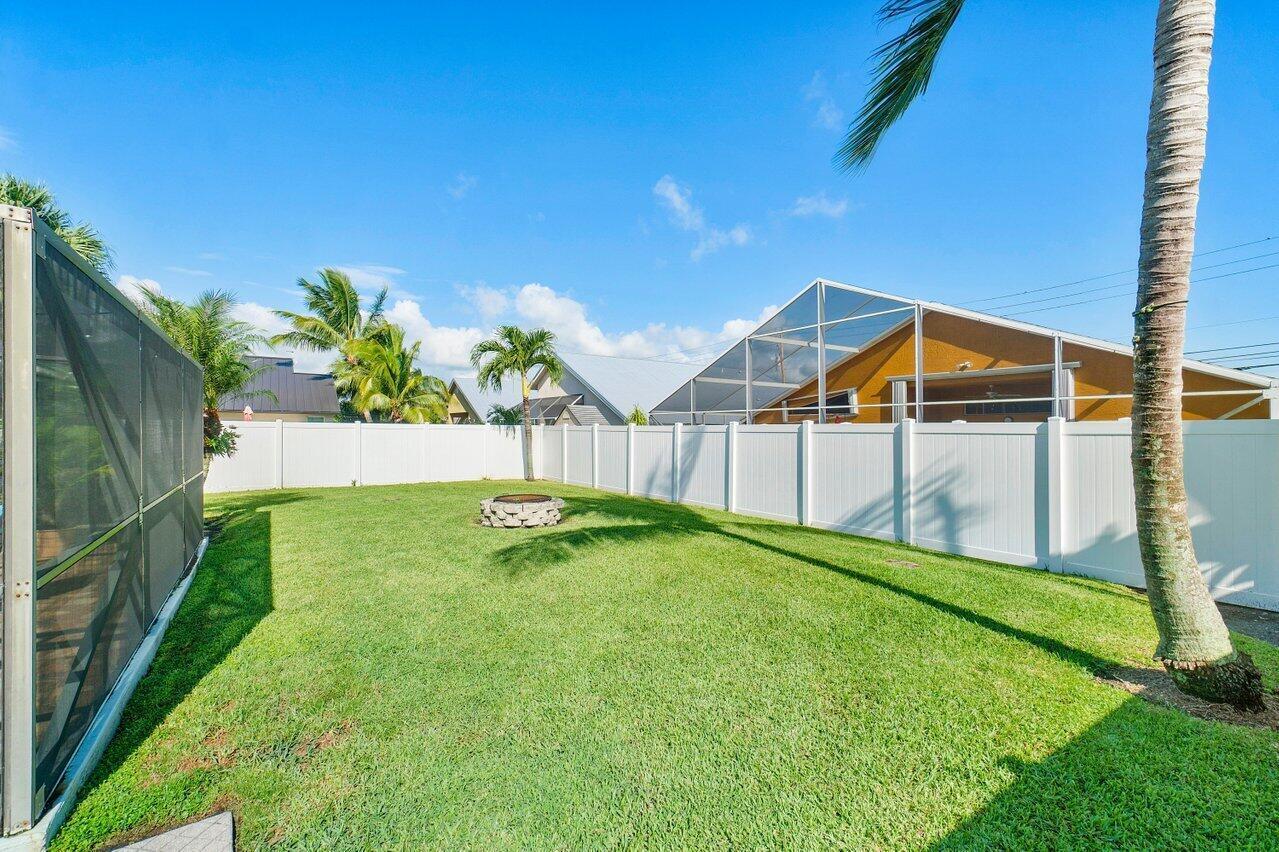 6085 Robinson Street Jupiter, FL 33458 - Photo 4 of 32 a view of backyard with swimming pool and seating space