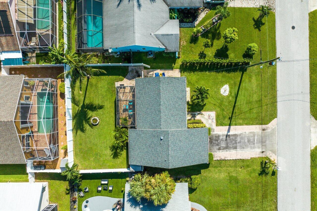 6085 Robinson Street Jupiter, FL 33458 - Photo 5 of 32 an aerial view of a house with a swimming pool