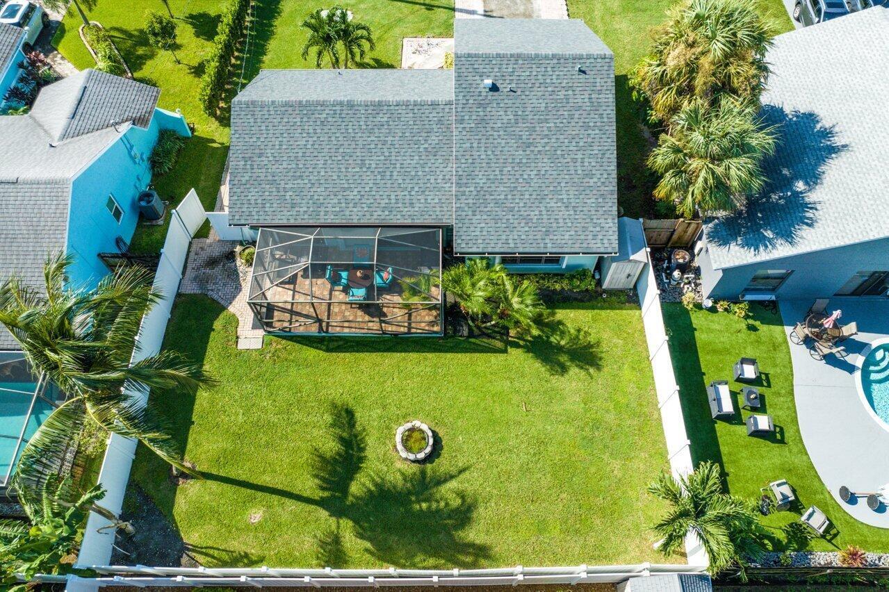 6085 Robinson Street Jupiter, FL 33458 - Photo 6 of 32 an aerial view of a house with swimming pool and garden