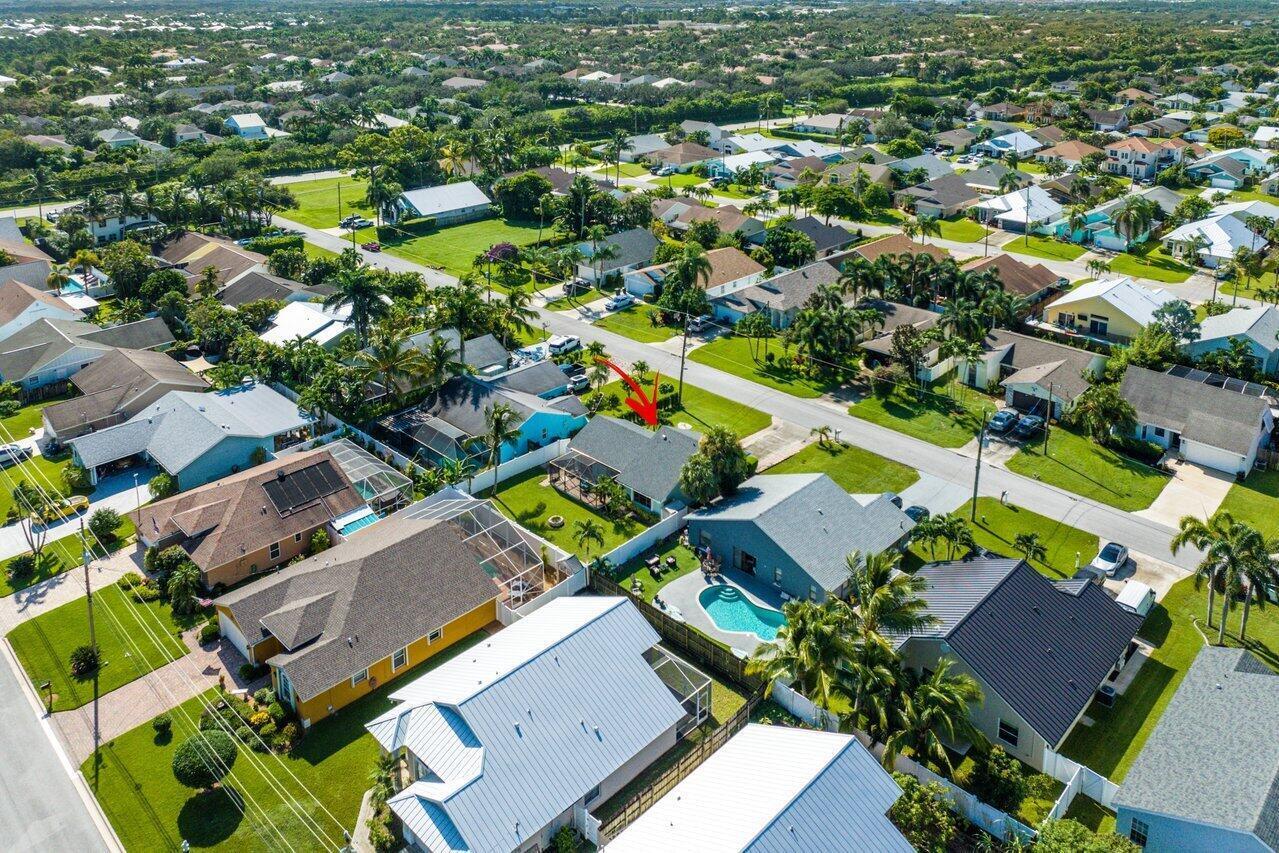 6085 Robinson Street Jupiter, FL 33458 - Photo 8 of 32 an aerial view of residential houses with outdoor space