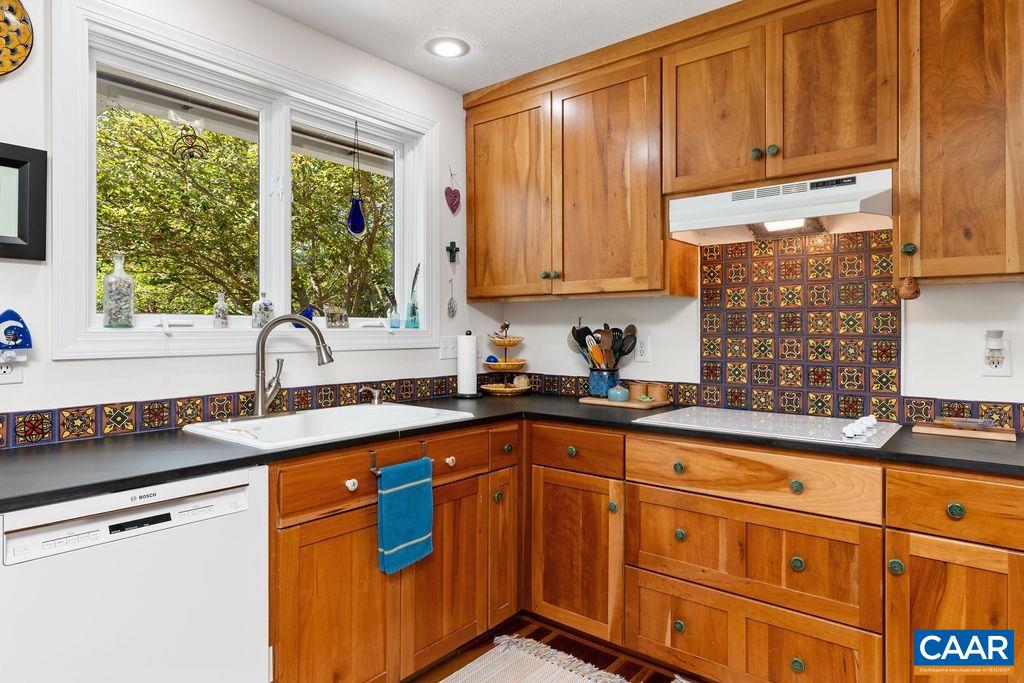 132 Reeds Gap Road Lyndhurst, VA 22952 - Photo 16 of 74 a kitchen with stainless steel appliances granite countertop a sink stove and cabinets