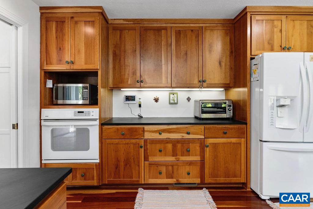132 Reeds Gap Road Lyndhurst, VA 22952 - Photo 19 of 74 a kitchen with stainless steel appliances a refrigerator and a stove