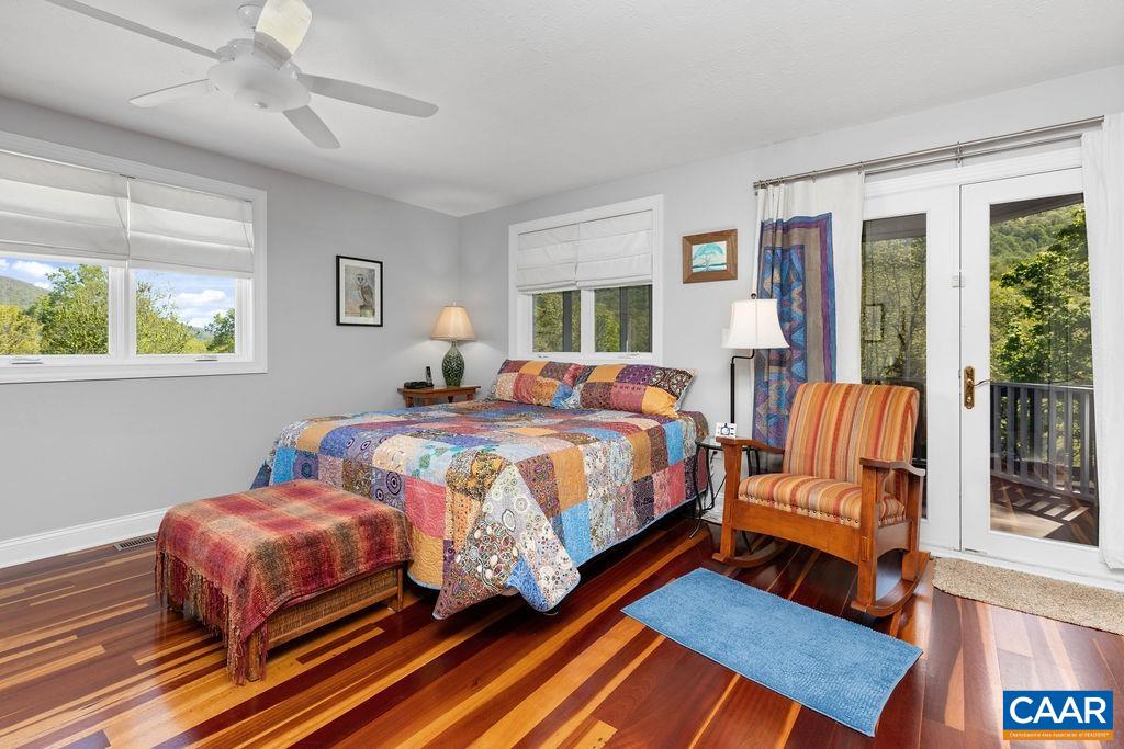 132 Reeds Gap Road Lyndhurst, VA 22952 - Photo 27 of 74 a bedroom with a bed and wooden floor