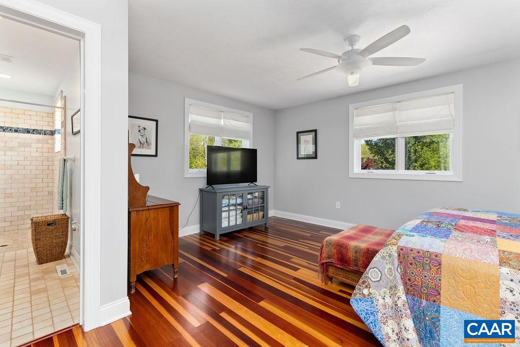 132 Reeds Gap Road Lyndhurst, VA 22952 - Photo 29 of 74 a bedroom with a bed and a flat screen tv