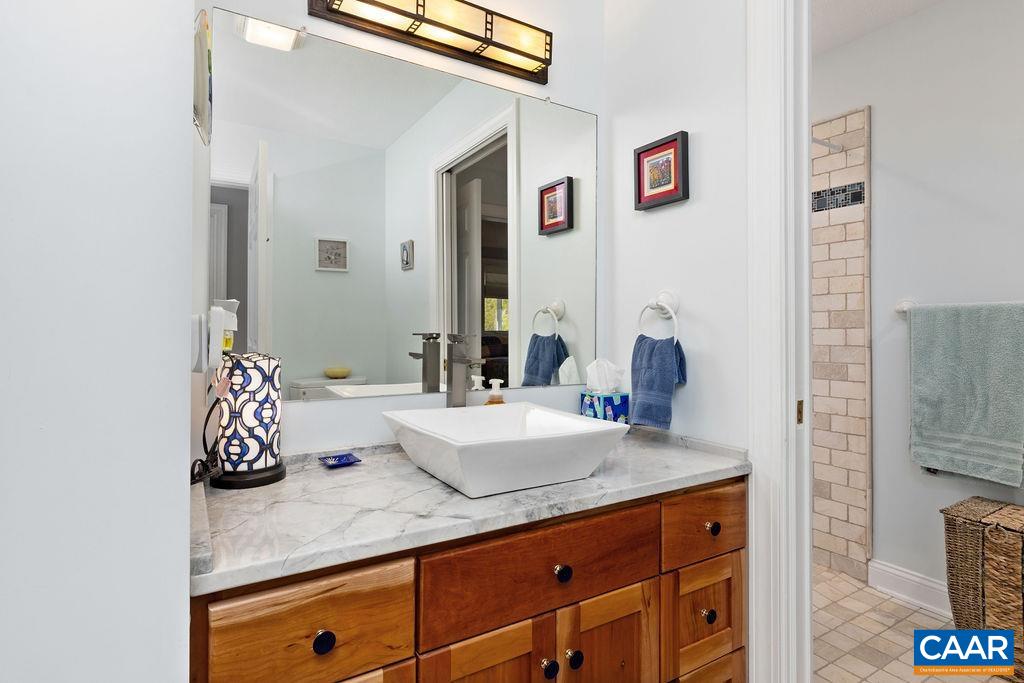 132 Reeds Gap Road Lyndhurst, VA 22952 - Photo 31 of 74 a bathroom with a sink and a mirror