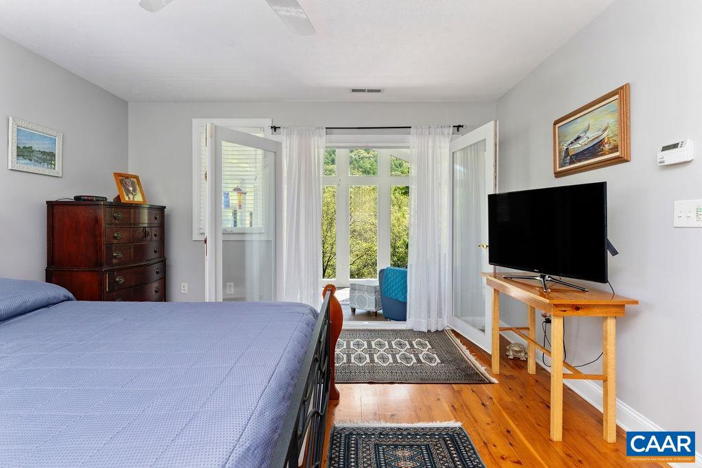 132 Reeds Gap Road Lyndhurst, VA 22952 - Photo 49 of 74 a bedroom with a bed and a flat screen tv