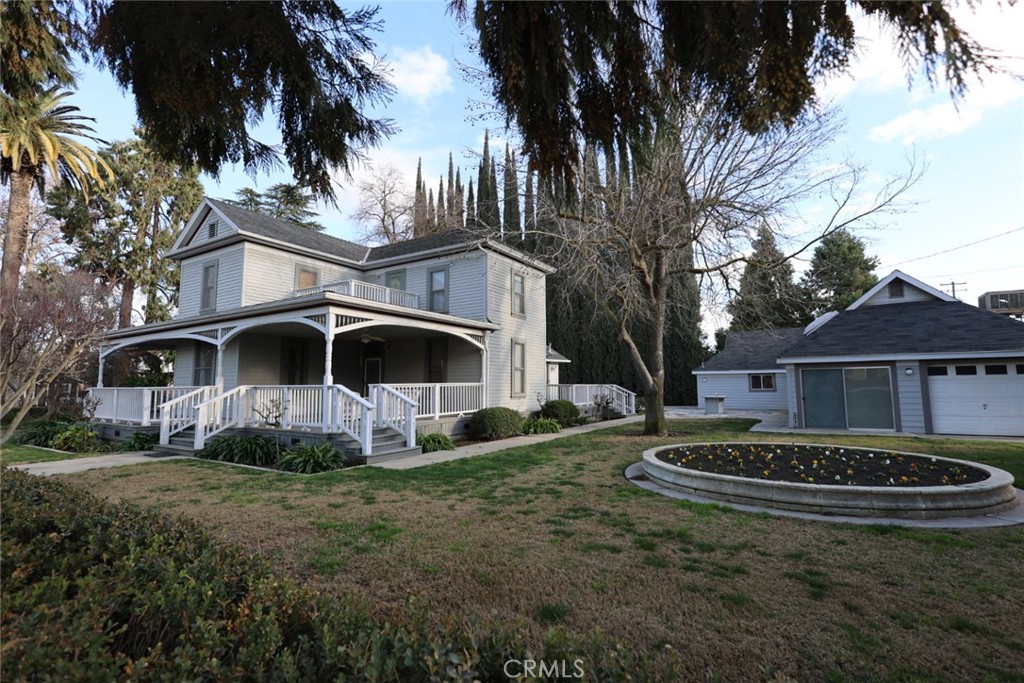 6375 Murphy Avenue Laton, CA 93242 - Photo 20 of 40 a view of a white house with a big yard and large trees