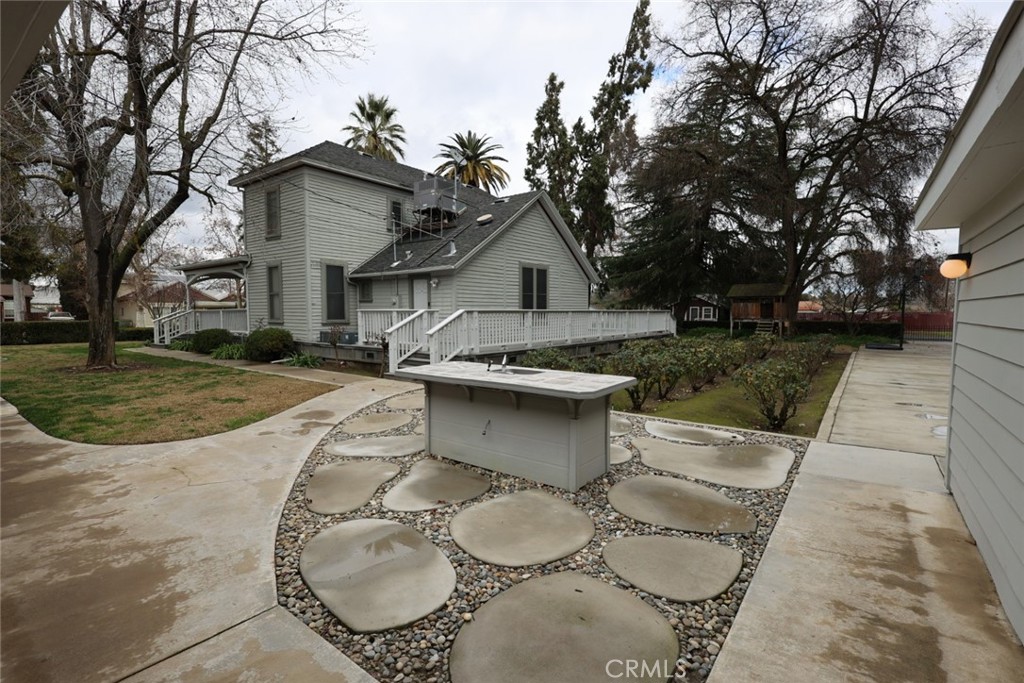 6375 Murphy Avenue Laton, CA 93242 - Photo 8 of 40 a view of a house with a yard garage and tree
