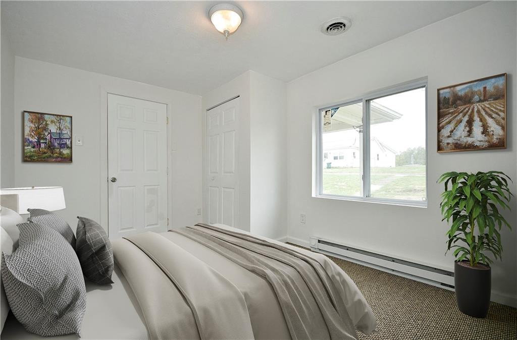 66 Chestnut Street Ellsworth, PA 15331 - Photo 17 of 28 a bedroom with a bed and a window