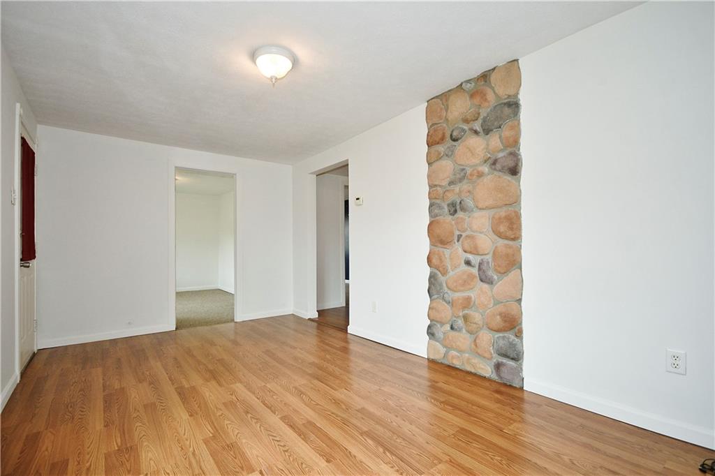 66 Chestnut Street Ellsworth, PA 15331 - Photo 7 of 28 a bedroom with a bed and wooden floor