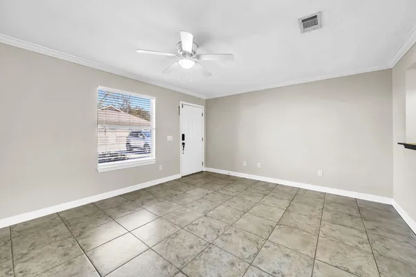 a view of an entryway with wooden floor and windows